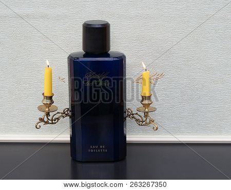 Davidoff Cool Water, Eau De Toilette, Large Perfume Bottle In Front Of A Piano Candelabra With Shini