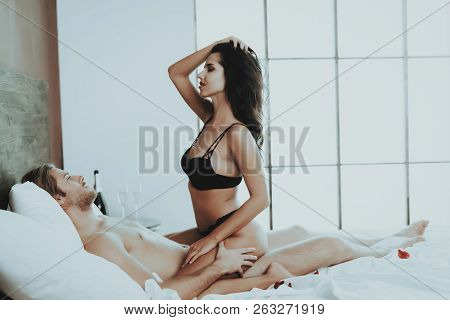 Brunette Girl. Person In Black Underwear. White Linens. Man On Bed. Woman With Sexy Man. White Shirt