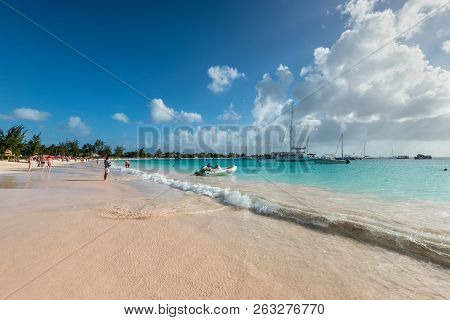 Bridgetown, Barbados - December 18, 2016: People Relaxing On The Brownes Beach At Ocean Coast At Sun