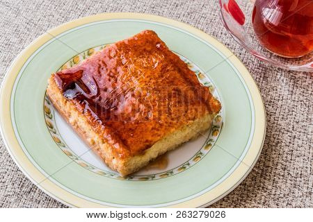 Balkan Dessert Cake Trilece With Caramel Sauce And Tea.