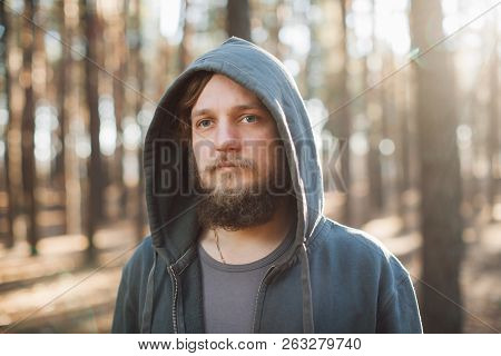 Man Is Standing In The Forest And Just Relaxing Dressed Like Homies In Dark Blue Goodie Downshifting