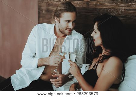 Brunette Girl. Person With Glasses Champagne. White Linens. Mans Shirt. Man On Bedroom. Woman With S