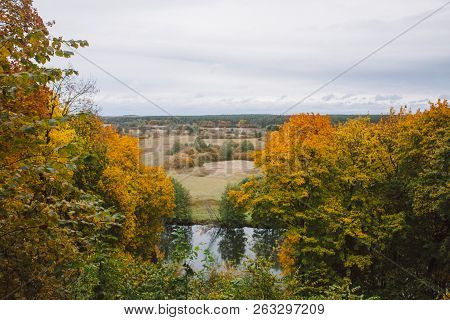 Autumn Landscape. Colourful Autumn Trees With Yellow Leaves In Ukrainian Park. The Picturesque Bank 