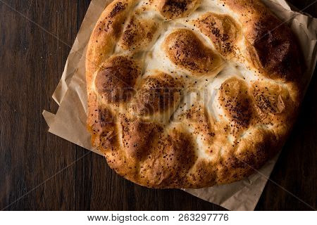 Turkish Ramadan Bread - Ramazan Pidesi On Wooden Surface / Pide