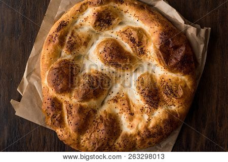 Turkish Ramadan Bread - Ramazan Pidesi On Wooden Surface / Pide