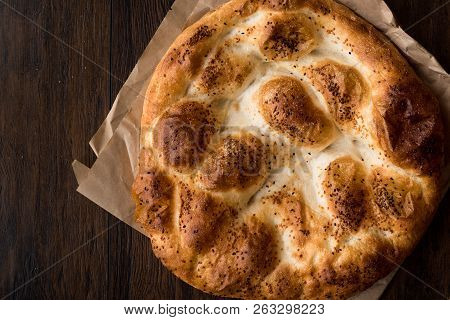 Turkish Ramadan Bread - Ramazan Pidesi On Wooden Surface / Pide