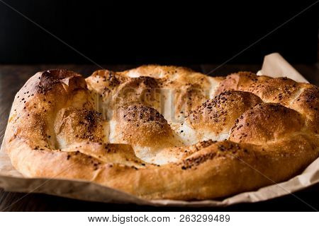 Turkish Ramadan Bread - Ramazan Pidesi On Wooden Surface / Pide