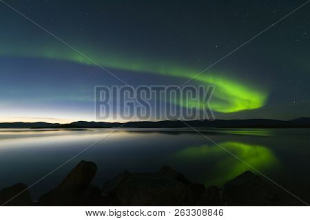 Landscape With Aurora Borealis And Tornetrask Lake. Northern Sweden
