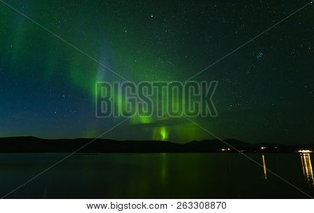 Landscape With Aurora Borealis And Tornetrask Lake. Northern Sweden