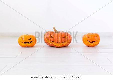 Halloween Pumpkins. Funny Jack Olantern On The Light Room