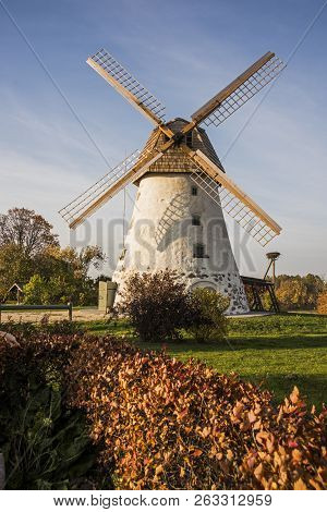Restored Old Windmill On The Mountainside. Autumn Sunny Day.