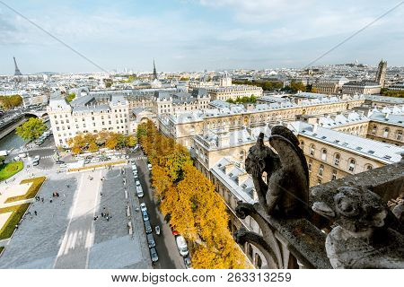 Aerial Panoramic View Of Paris With Gargoyle Sculpture On The Notre-dame Cathedral During The Mornin