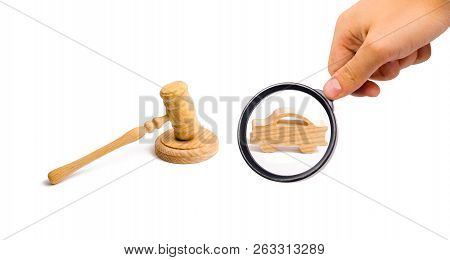 Wooden Figurine Of A Car In The Hammer Of A Judge On A White Background. Minimalism. Purchase And Sa