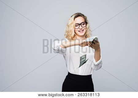 Beautiful Young Businesswoman Scattering Money Isolated On White Background