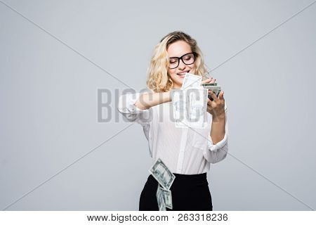 Beautiful Young Businesswoman Scattering Money Isolated On White Background
