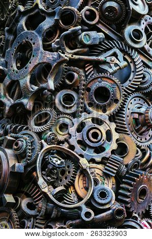 Steampunk Background, Machine Parts, Large Gears And Chains From Machines And Tractors. Old Rusty Ma