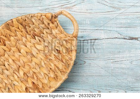 Whickered Empty Basket Light Color On A Blue Wooden Table