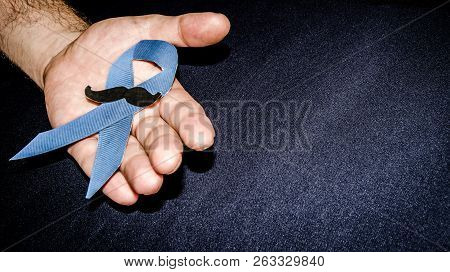 Man Holding A Blue Ribbon, Blue November Concept