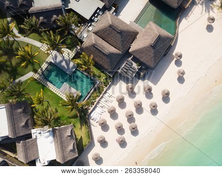 Aerial View Of Amazing Tropical White Sandy Beach With Palm Leaves Umbrellas And Turquoise Sea, Maur