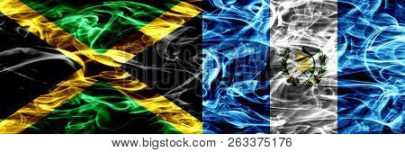 Jamaica Vs Guatemala, Guatemalan Smoke Flags Placed Side By Side. Thick Colored Silky Smoke Flags Of