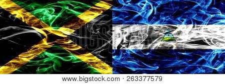 Jamaica Vs Nicaragua, Nicaraguan Smoke Flags Placed Side By Side. Thick Colored Silky Smoke Flags Of