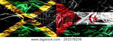 Jamaica Vs Sahrawi Smoke Flags Placed Side By Side. Thick Colored Silky Smoke Flags Of Jamaican And 