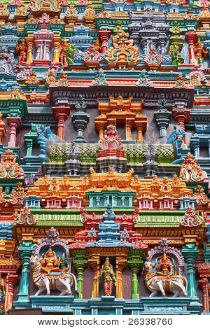 Sculptures on Hindu temple gopura (tower). Menakshi Temple, Madurai, Tamil Nadu, India