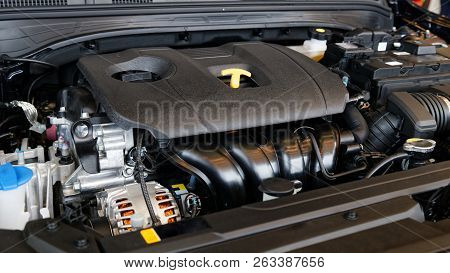 Close Up Detail Of New Car Engine Under The Open Hood. Shallow Focus.
