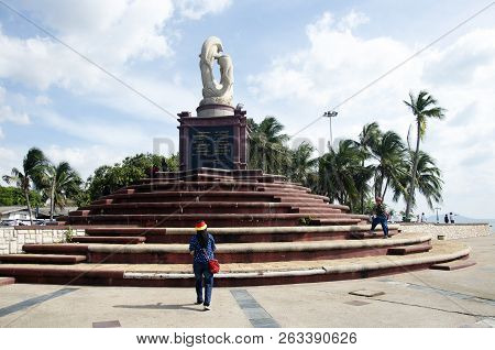 Thai People Travel And Visit Sculpture Of Dolphins On The Waves Monument In Chonburi, Thailand