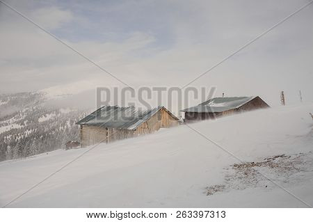 Winter Landscape Of Two Snow Covered Houses On The Mountain Hill On The Popular Tourist Resort In Go