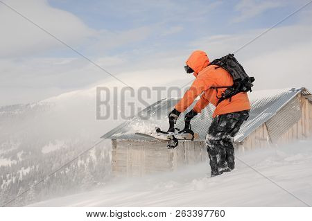 Man Holding The Snowboard In Hands On The Hill In The Mountain In The Tourist Resort In Goderzi, Geo