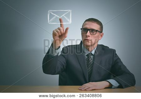 Businessman Pointing On A Email Symbol By His Index Finger. Get Letter.