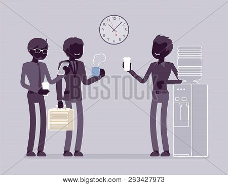 Office Cooler Chat. Young Male Workers Having Informal Conversation Around A Watercooler At Workplac