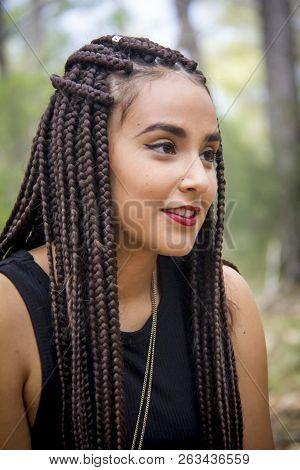 Young And Beautiful Girl With Braided Hair