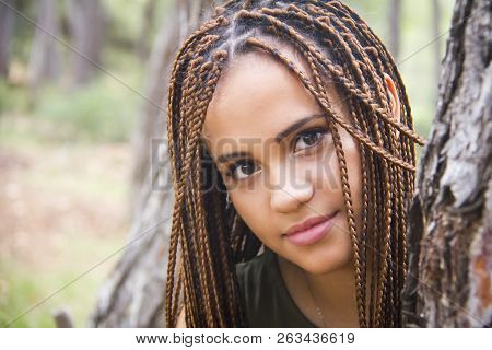 Young And Beautiful Girl With Braided Hair