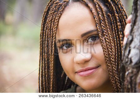Young And Beautiful Girl With Braided Hair
