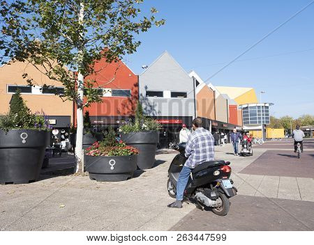Lelystad, Netherlands, 10 Oktober 2018: Man Sits On Motor Scooter In Shopping Centre Of Flevoland Ca
