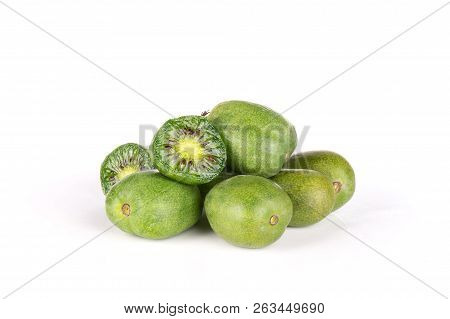 Stack Of Lot Of Whole Two Halves Of Fresh Green Mini Baby Kiwi Fruit Isolated On White Background