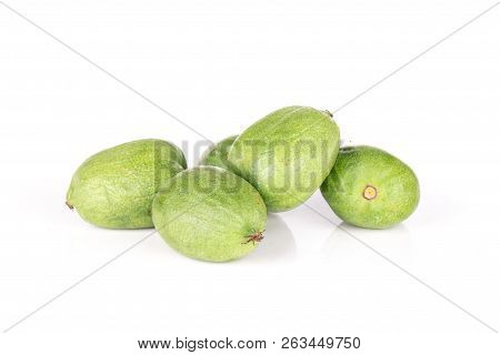 Group Of Five Whole Fresh Green Mini Baby Kiwi Fruit Isolated On White Background