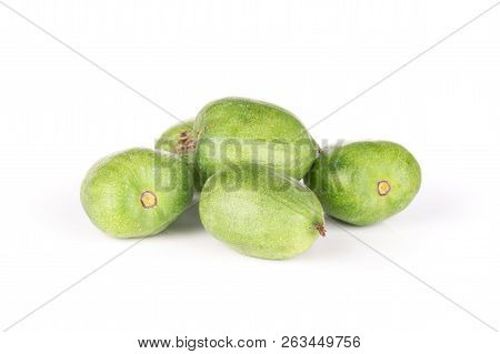 Stack Of Five Whole Fresh Green Mini Baby Kiwi Fruit Isolated On White Background