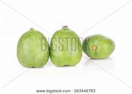 Group Of Three Whole Fresh Green Mini Baby Kiwi Fruit Isolated On White Background