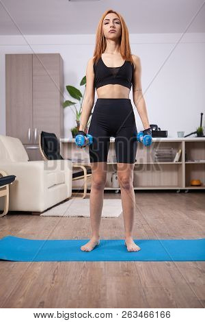 Fit Girl Doing Lateral Shoulder Rises In Her Home Training Progam