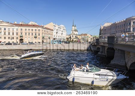 St. Petersburg, Russia - August 08, 2018: Pleasure Boat Sails Under The Belinsky Bridge On The Fonta