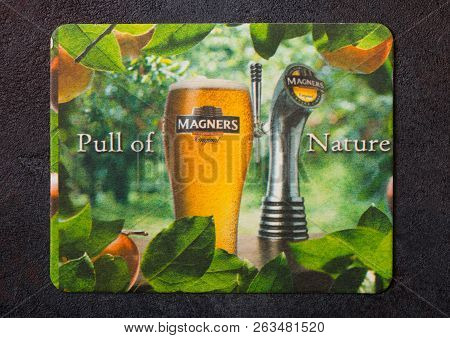 London, Uk - August 22, 2018: Magners Cider Original Paper Mat Coaster On Black Background.