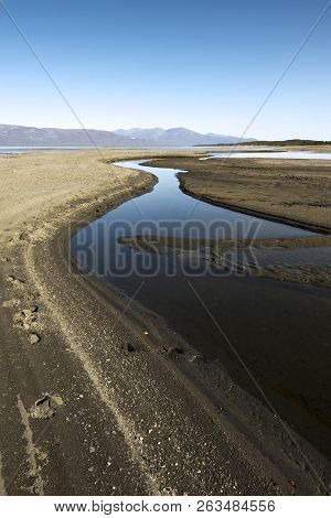 Autumn Landscape With Tornetrask Lake And Mountains In Background. Northern Sweden