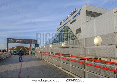 Royal Dock, Custom House, London, Uk - February 14, 2018: Man Walking Up Incline Towards The West En