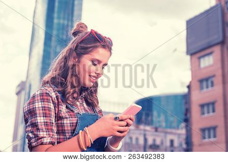 Dark-haired Girl Wearing Beautiful Ring On Index Finger Typing Message