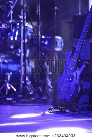 Electric Bas Guitar On A Stand In Rock Concert