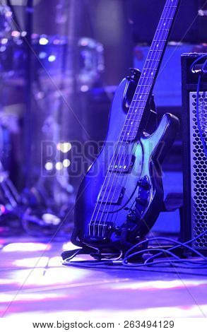 Electric Bas Guitar On A Stand In Rock Concert