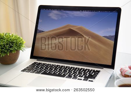 Alushta, Russia - September 28, 2018: Backgrounds Macos Mojave In The Screen Of Macbook Pro. Macbook